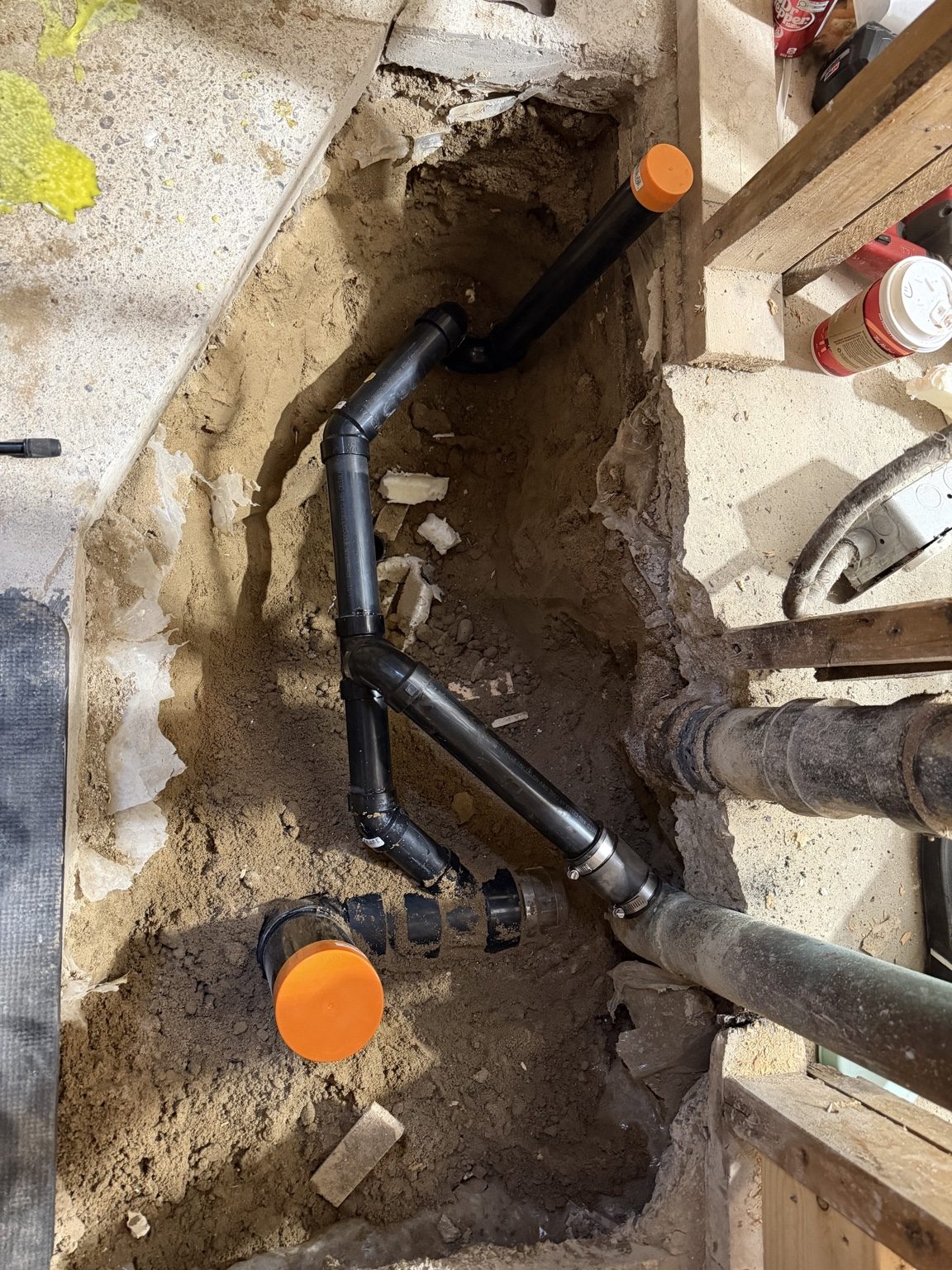 Exposed plumbing and underground work during a renovation project