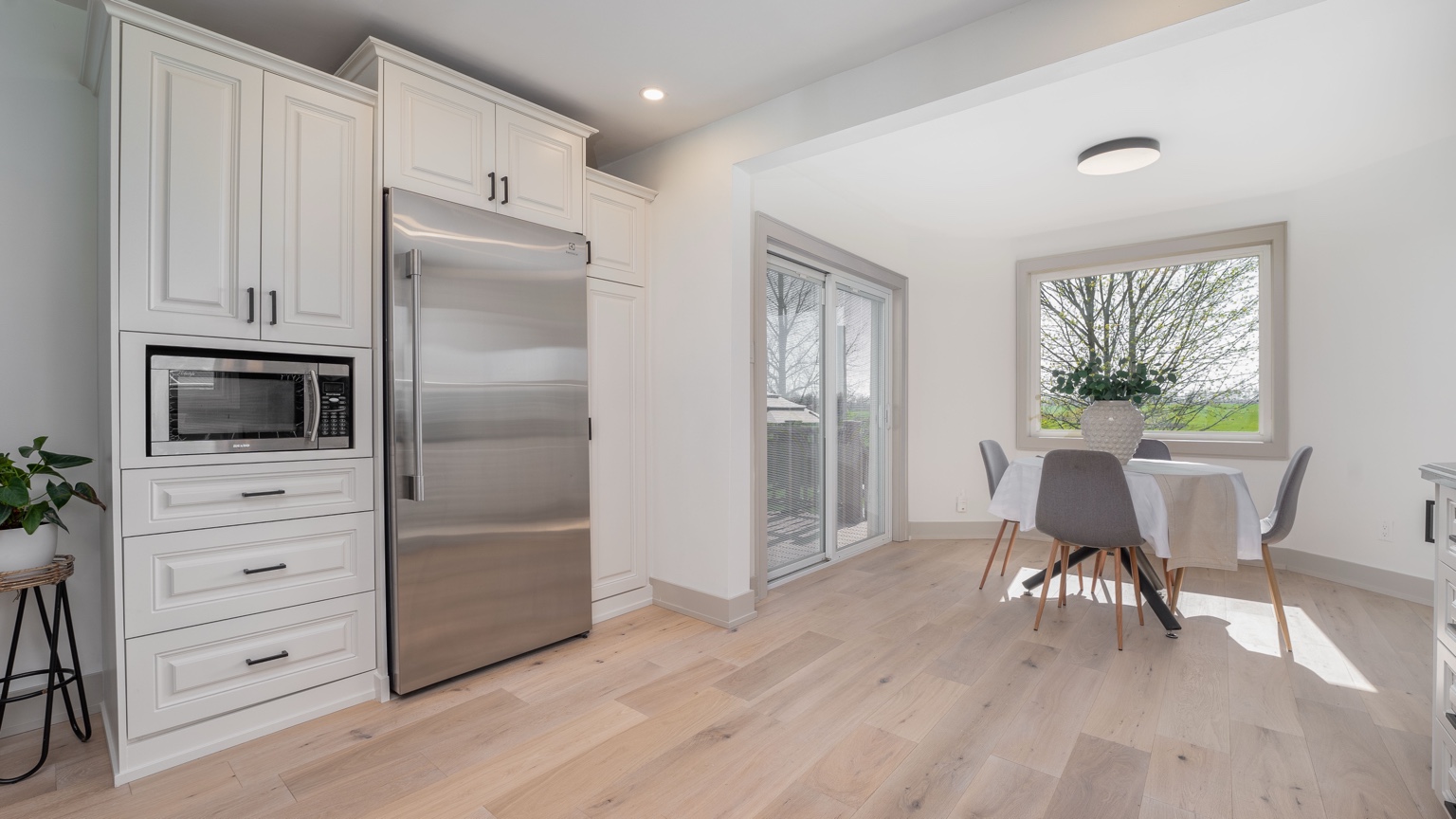 Renovated kitchen and dining area with large picture window